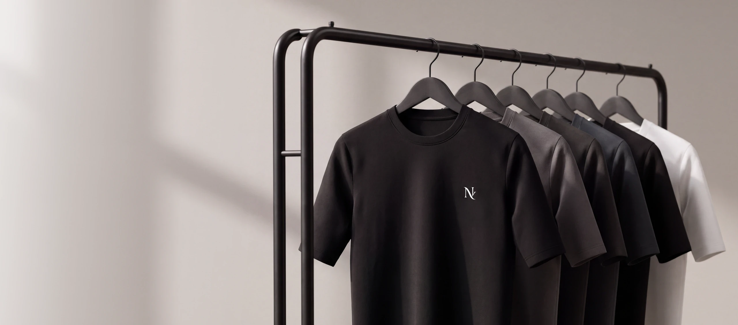 Rack of Norvio Vale oversized tees in multiple colorways